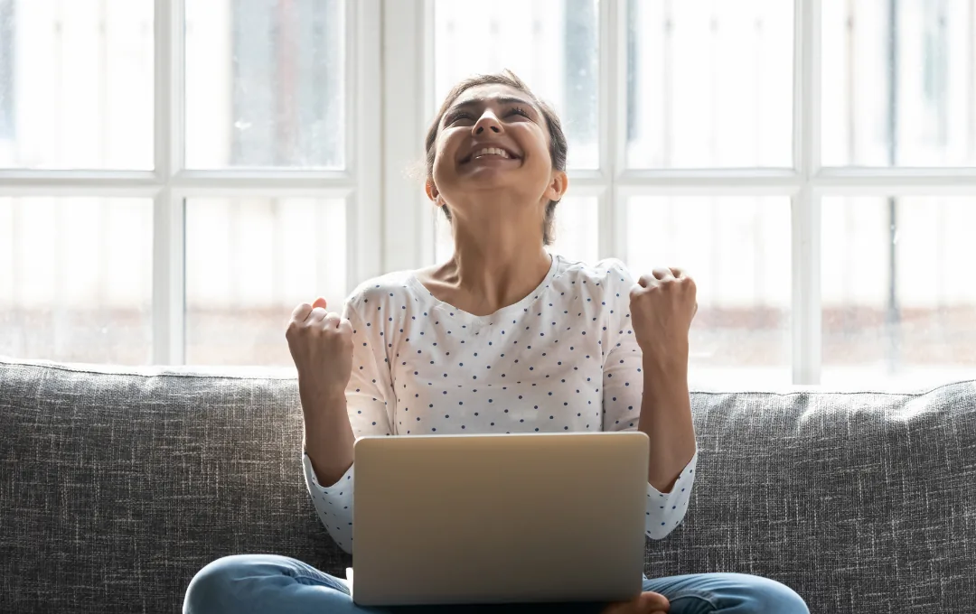 Happy business owner celebrating results from her website